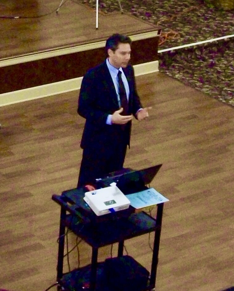 RJon Robins speaking during his early advisory years