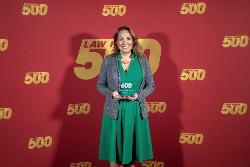 AG Immigration Law PA holding its 2026 Law Firm 500 winner award