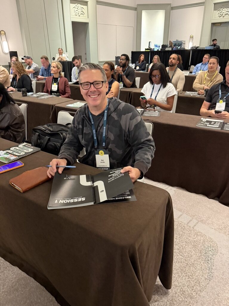 Smiling HTM member seated at a How To Manage A Small Law Firm event