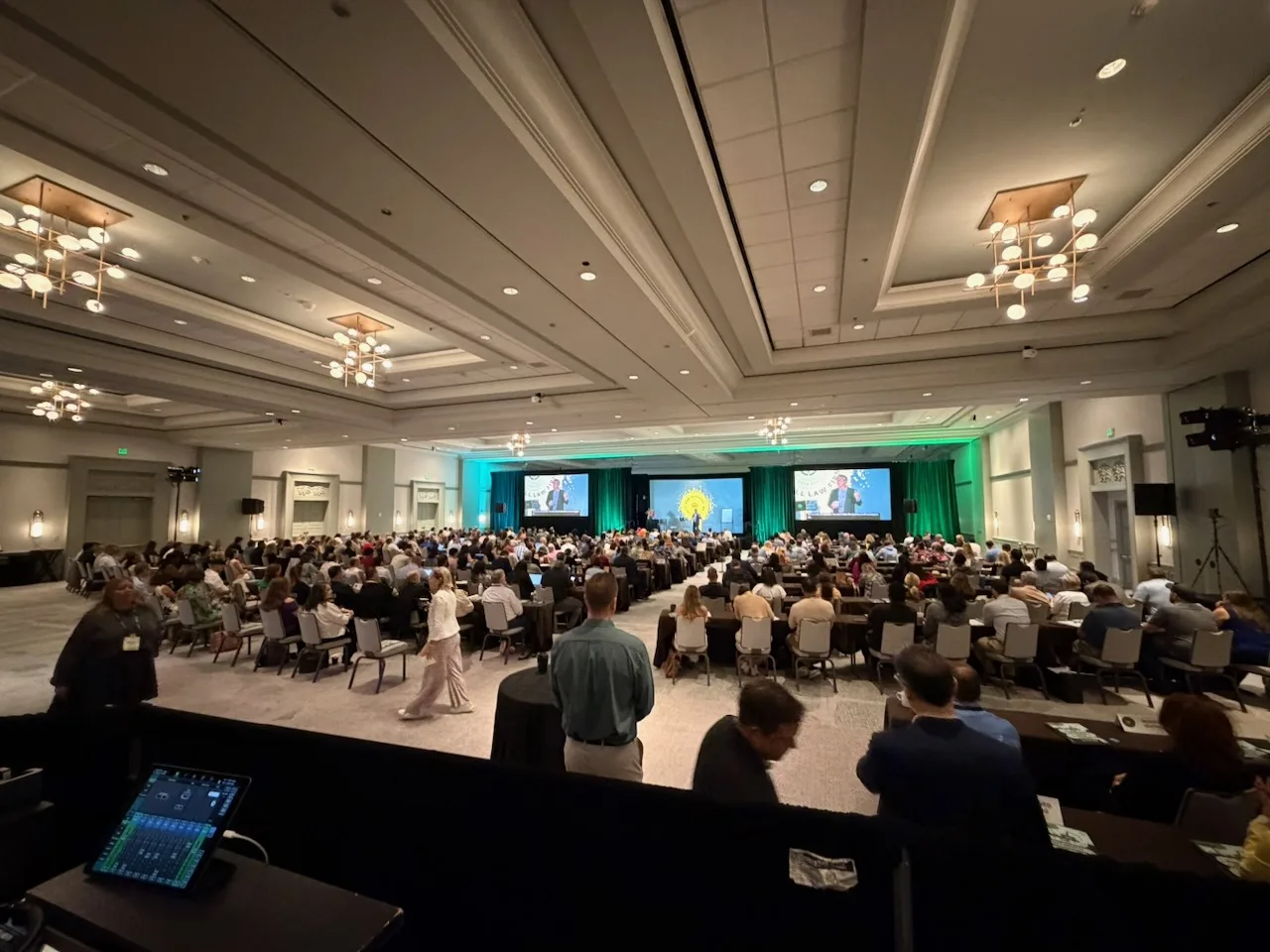 A packed HTM ballroom filled with law firm owners facing a live presentation.