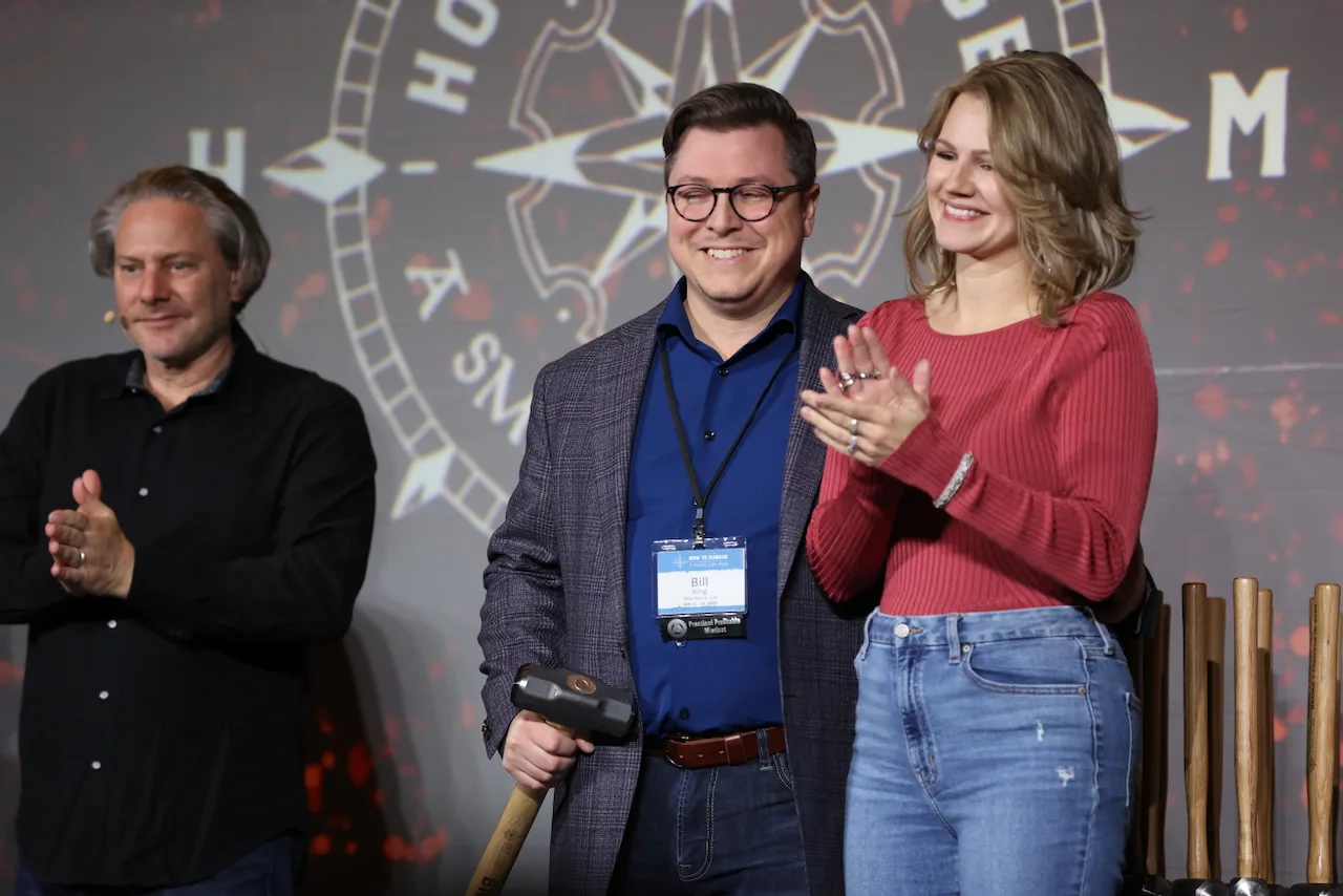 HTM members smiling together during a moment of recognition.