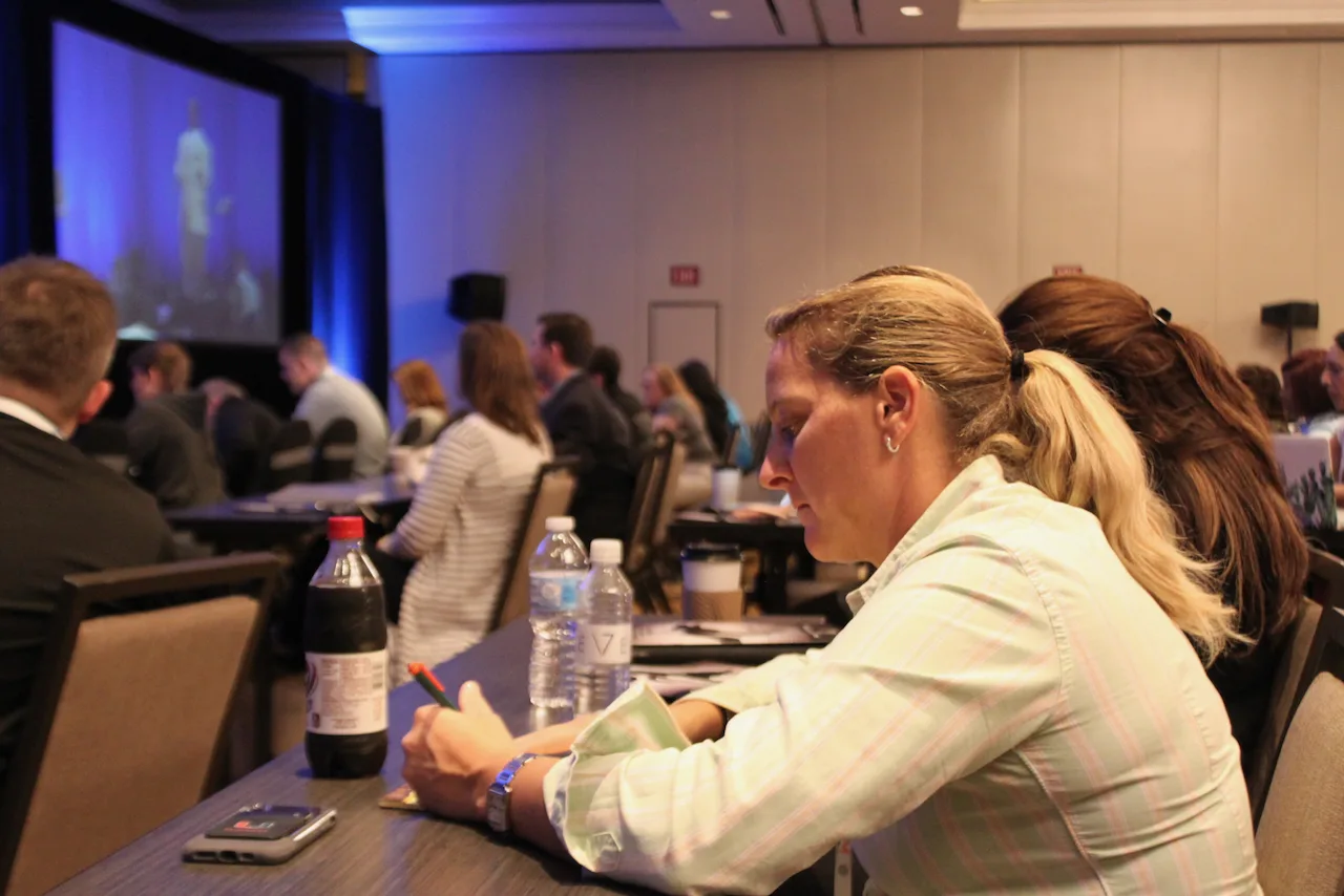 Law firm owners collaborating around a table during a working session.