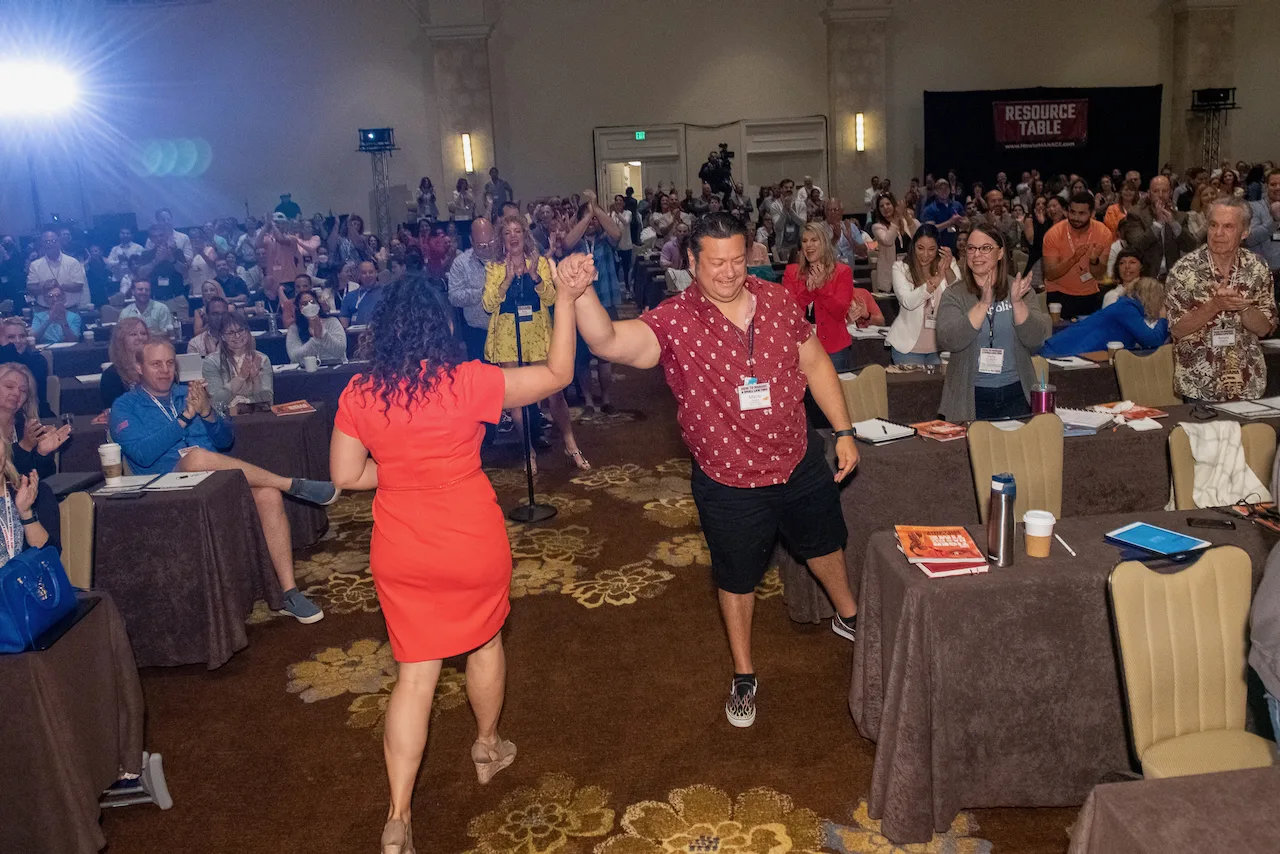 Members celebrating together during an energetic HTM event moment.