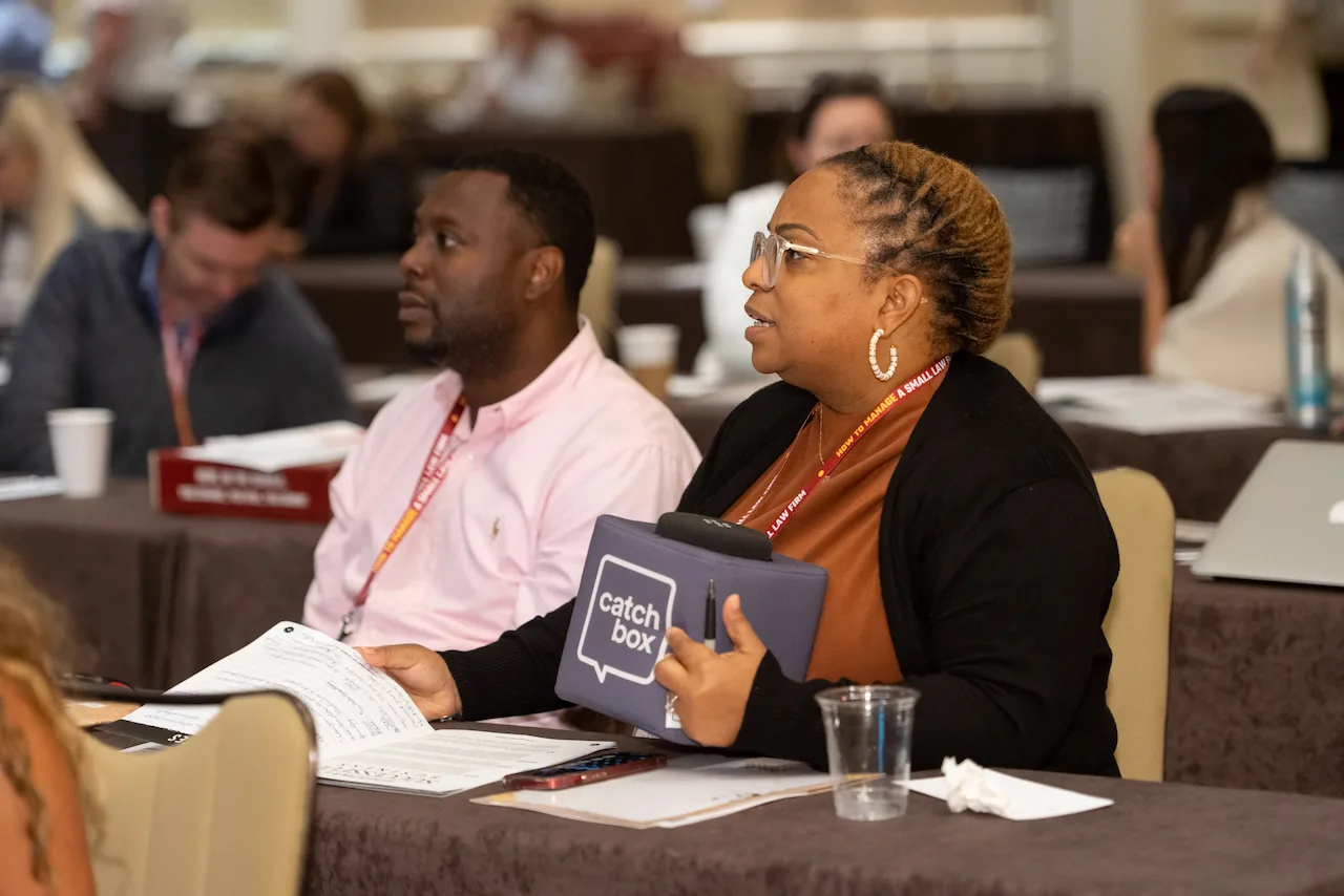 Two law firm owners listening closely during an HTM working session.