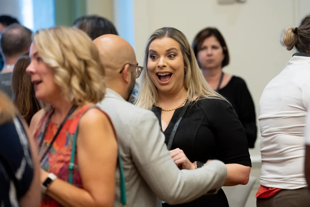 Two law firm owners sharing a laugh during an HTM event.
