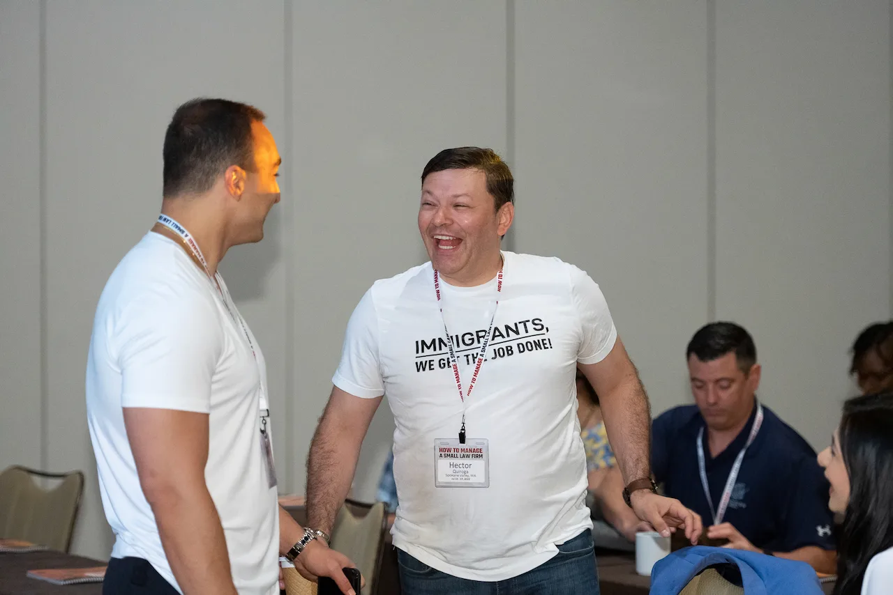 Two law firm owners sharing a laugh during an HTM working session.